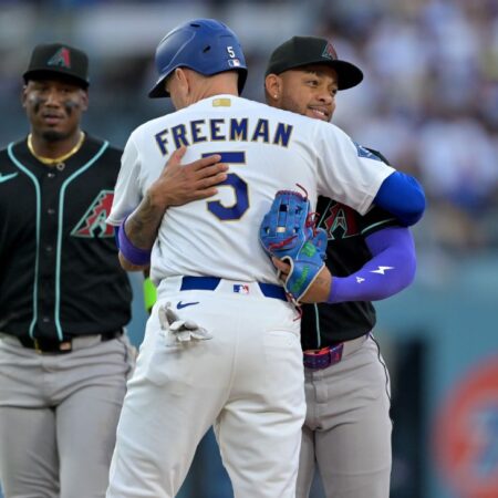Easily out, Dodgers’ Freeman tagged out with hug