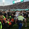Several injured as fans clash with police in Paraguay’s Superclasico match