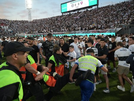 Several injured as fans clash with police in Paraguay’s Superclasico match