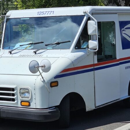 Troubled Postal Service moves to raise stamp prices, conserve cash