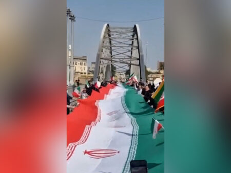 Iranians form human chains across bridges, at power plants