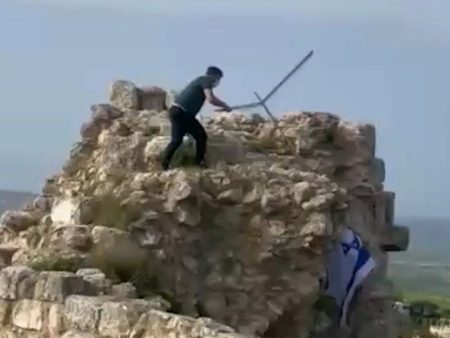 Lebanese man removes Israeli flag from castle in southern Lebanon