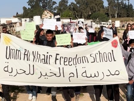 Palestinian children protest against siege on their school