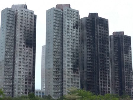 ‘Nothing left’: Hong Kong fire survivors return to burnt homes