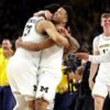 Michigan holds off UConn to win 2nd hoops title