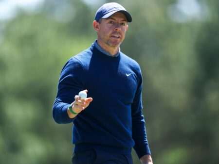 Rory opens defense with 67, share of early lead
