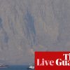 Middle East crisis live: tanker hit by ‘projectiles’ in strait of Hormuz after Trump says US will help ‘guide’ stranded ships