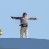 Iran war protester speaks to Al Jazeera from top of Washington bridge