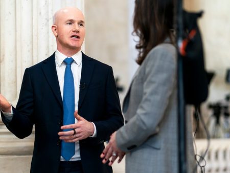 Coinbase laying off hundreds of employees, citing AI advancements
