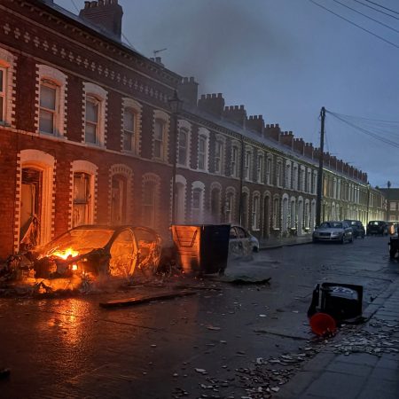 Protesters torch cars, buildings in Belfast after refugee knife attack