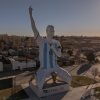 A Sculptor Rushes to Finish a Lionel Messi Statue During the World Cup