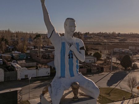 A Sculptor Rushes to Finish a Lionel Messi Statue During the World Cup