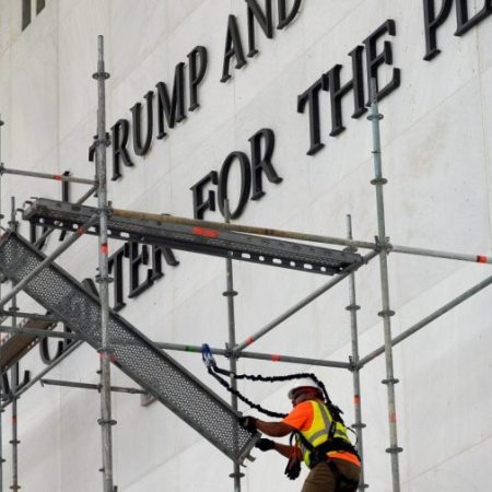 Crews begin stripping Trump name from Kennedy Center after court ruling, weather delay