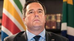 Leader of South Africa’s second biggest party wants his predecessor sacked as minister