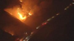 Watch: California wildfires rage near passing vehicles