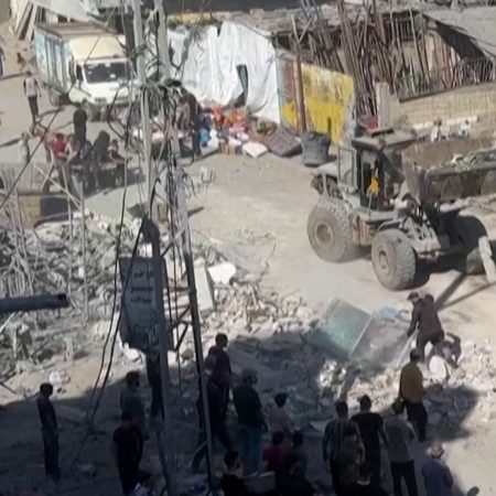 Families clear rubble after overnight Israeli strikes in Gaza